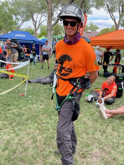Scott Preston in climbing gear at a tree climbing championship